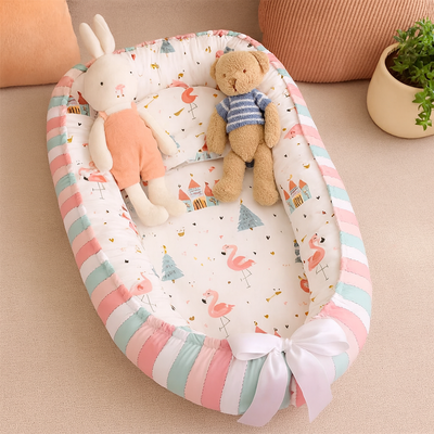 réducteur de lit bébé cocon d'or avec doudou