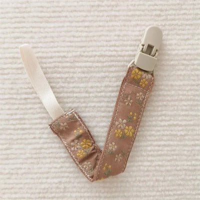 attache tetine chaine de sucette fleur jaune