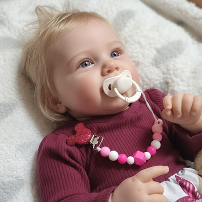 attache tetine clips de sucette rose foncé bébé couché