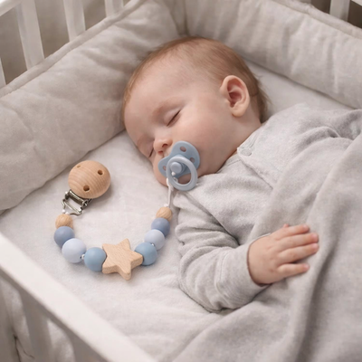 attache tetine perle ronde enfant couché