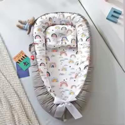 cocon bébé dodo arc-en-ciel confortable