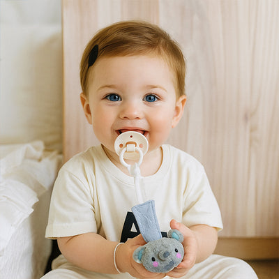 doudou attache tetine safari éléphant bébé assis