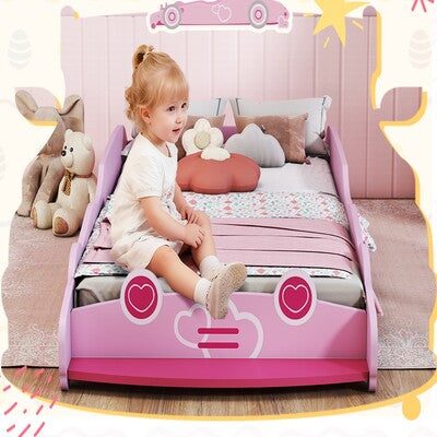lit par terre fille rose enfant souriant