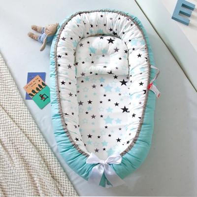 réducteur de lit bébé cocon d'or confortable