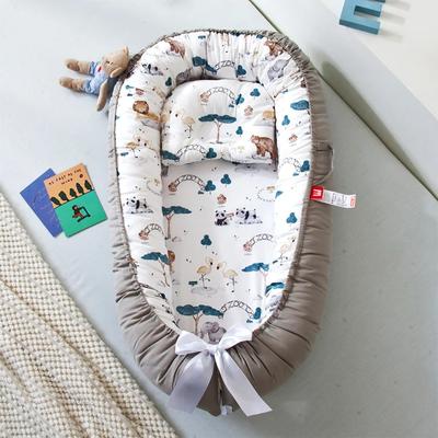 réducteur de lit bébé cocon d'or rassurant