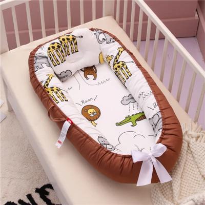 réducteur de lit bébé portable apaisant