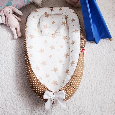 réducteur de lit bébé portable très pratique