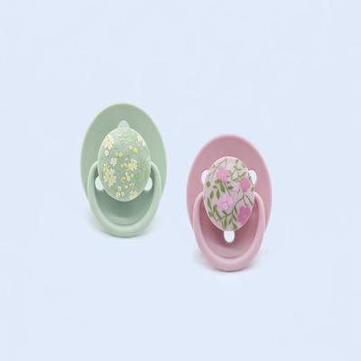 tétine bébé multicolore vert et rose