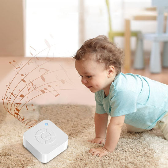 veilleuse bruit blanc facilitateur de sommeil enfant jouant sur tapis