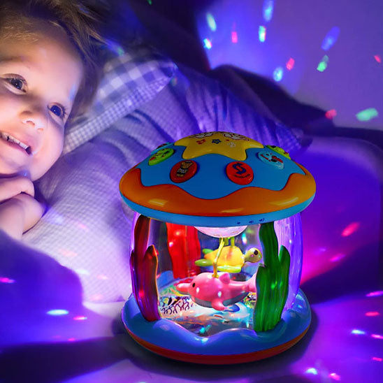 veilleuse projection bebe océanique bébé couché souriant